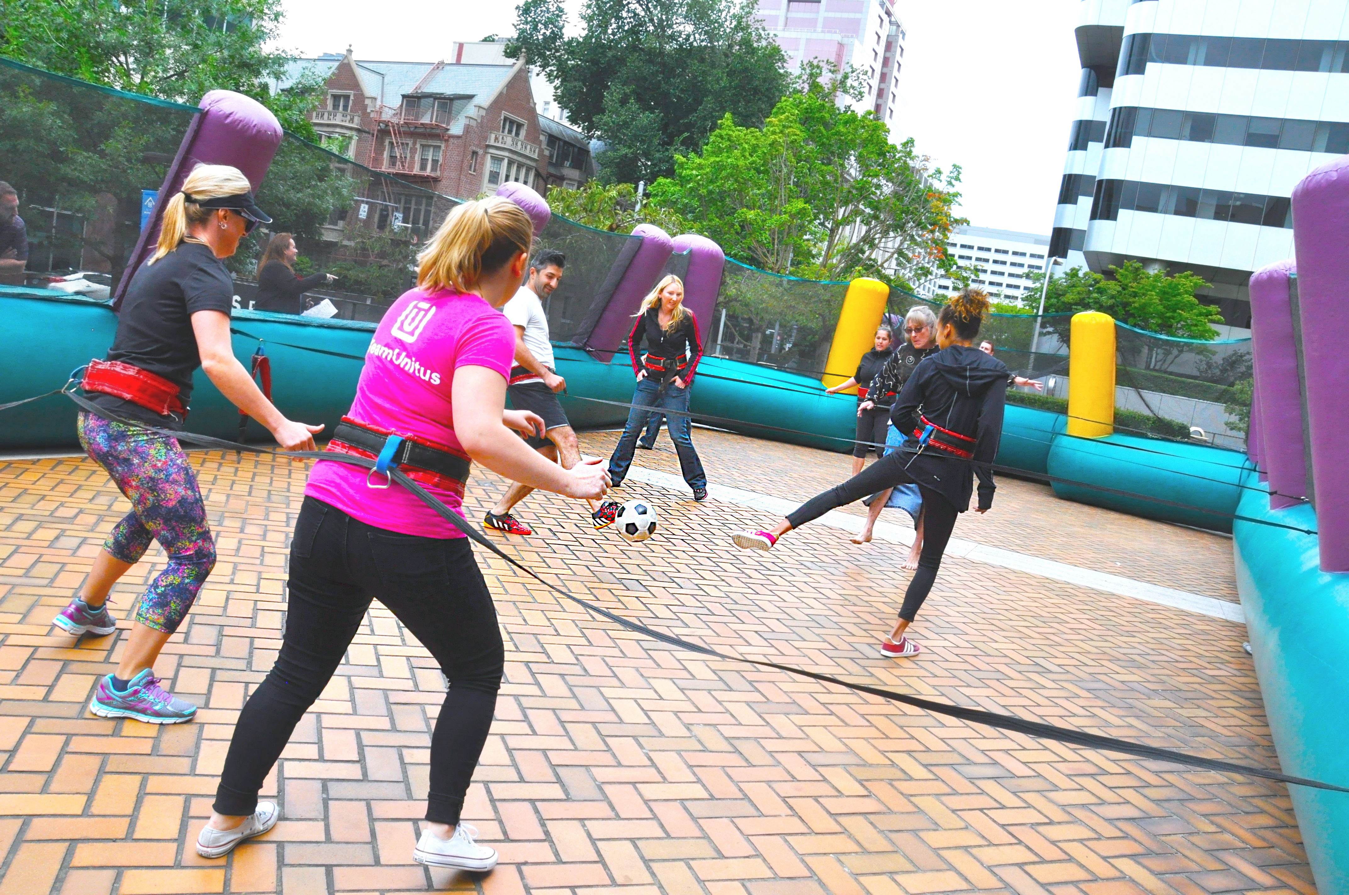 Teams playing Human Foosball in Unitus Plaza downtown Oregon