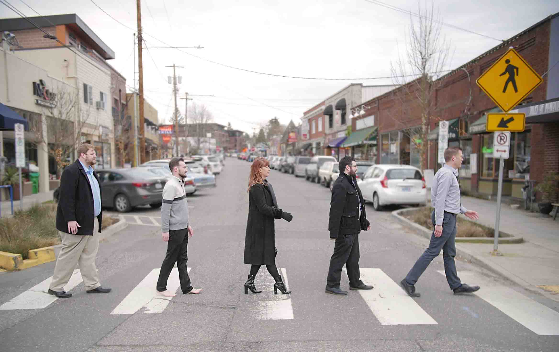 Multnomah Village branch staff in crosswalk like the beatles abby road album