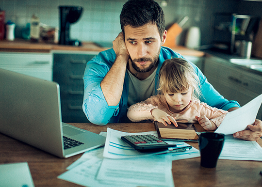 dad-with-child-stressing-about-debt