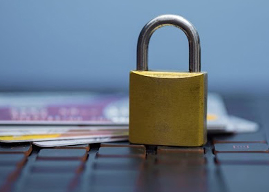 Lock sitting on top of credit cards